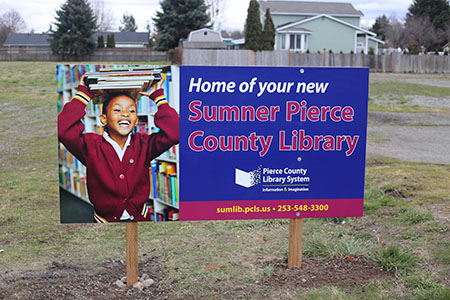 Signage in vacant lot signifies the future home of Sumner Library